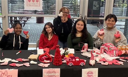 Students show valentine cutouts at Furr high school.